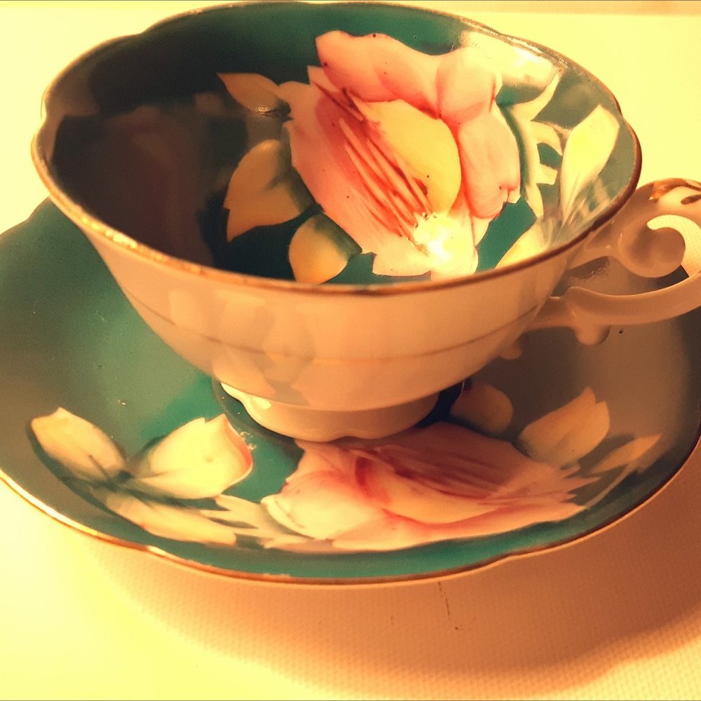 Green floral tea cup and saucer in fine bone china